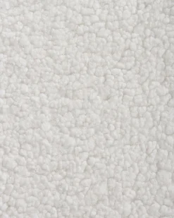 Fotel bujany tapicerowany boucle biały