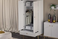 KONSIMO ISORIA Wysoka elegancka szafa z drążkiem na złotych nogach glamour